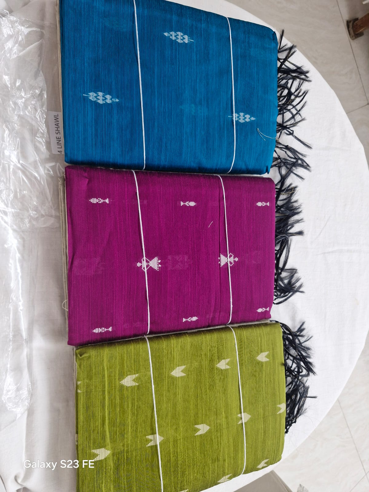Handloom ikat cotton sarees in blue, magenta and olive with tassels